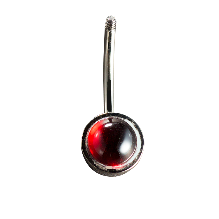 Piercing banana with cabochon-cut Garnet