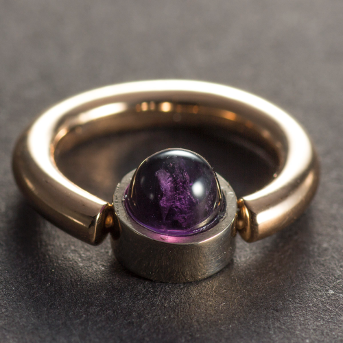 Piercing ring with an Amethyst Cone